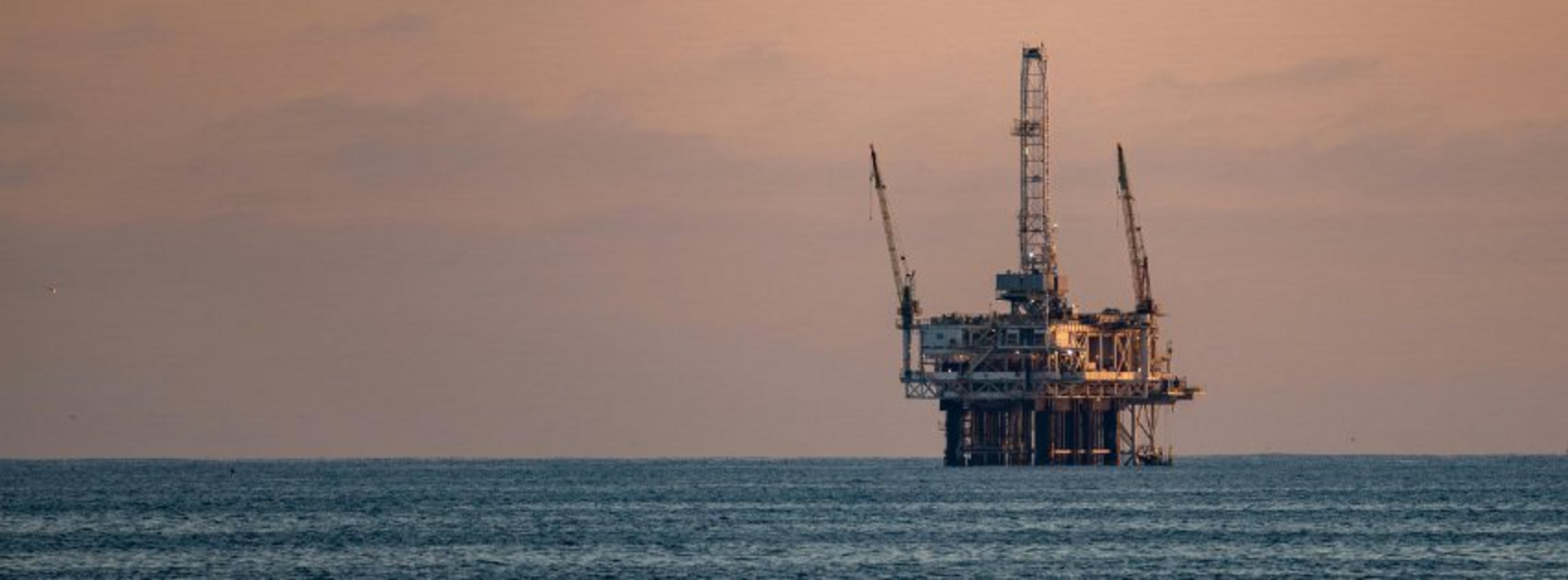 Deepwater oil rig at sunset